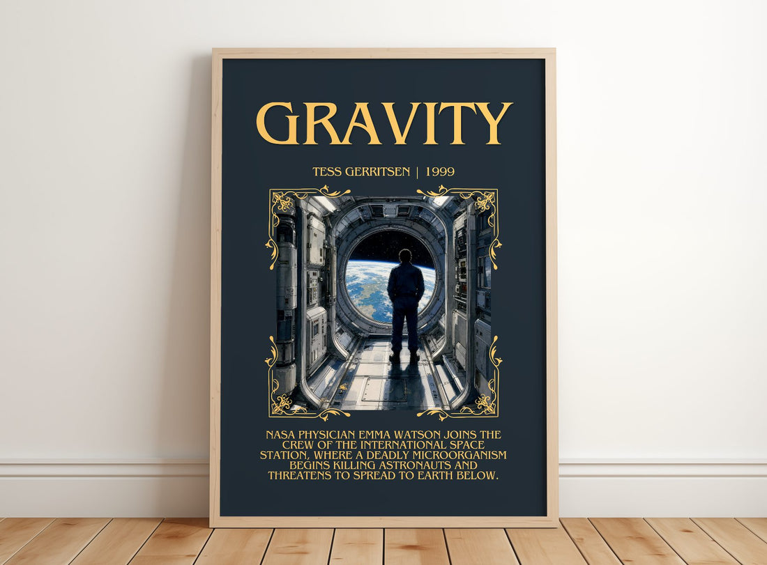 Gravity Minimalist Book Poster by Tess Gerritsen – framed print leaning on a wooden floor