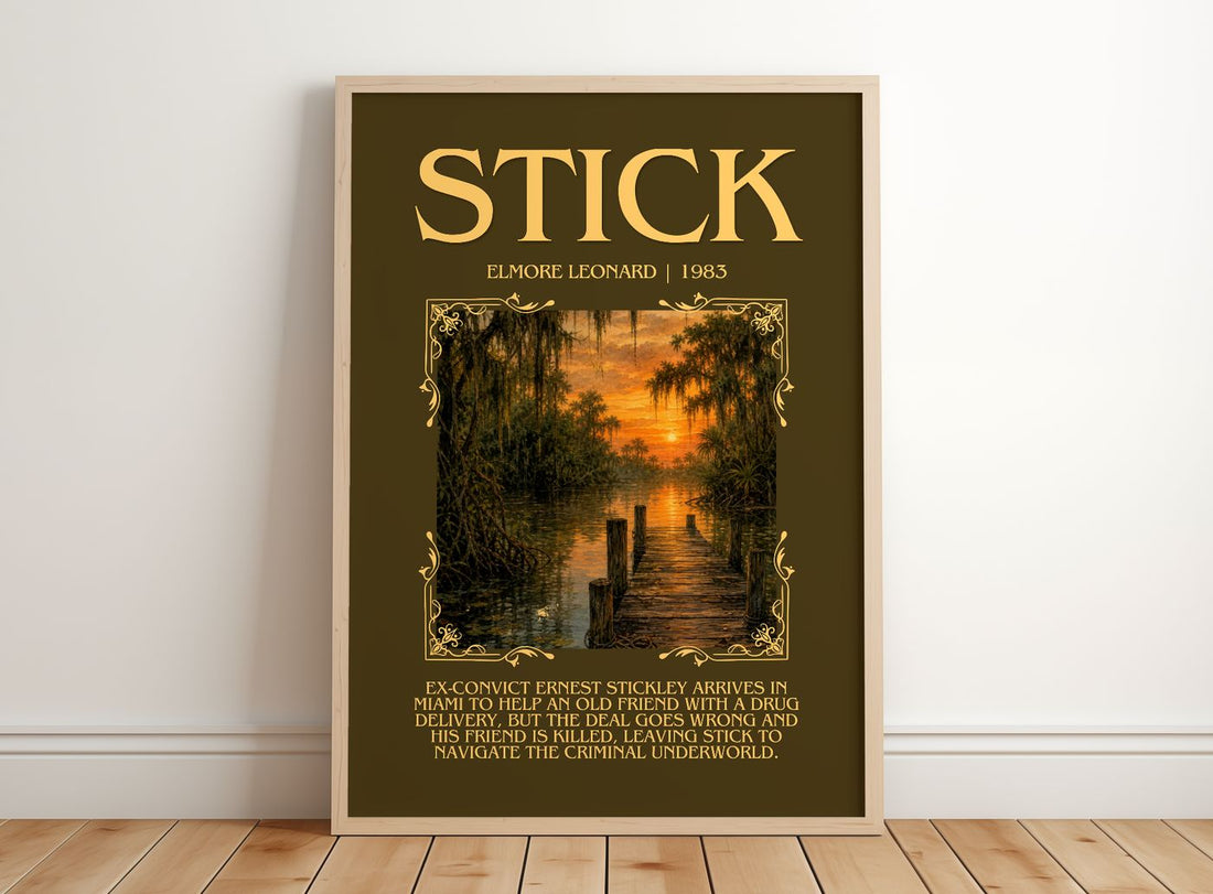 Stick Minimalist Book Poster by Elmore Leonard – framed print leaning on a wooden floor