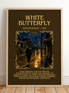 White Butterfly Minimalist Book Poster by Walter Mosley – framed print leaning on a wooden floor