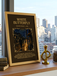 White Butterfly Minimalist Book Poster by Walter Mosley – framed print on a city-view windowsill