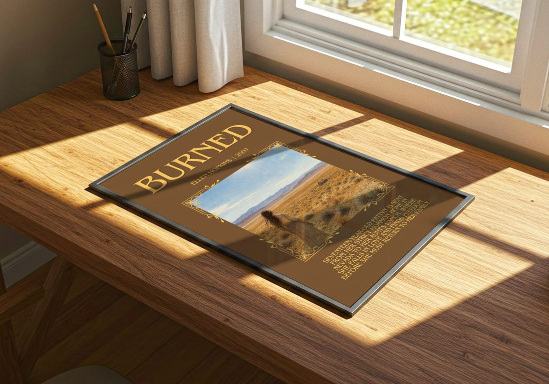Burned Minimalist Book Poster by Ellen Hopkins – print on a sunlit desk