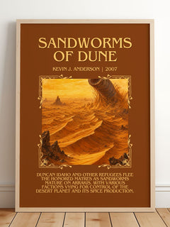 Sandworms of Dune Minimalist Book Poster by Kevin J. Anderson – framed print leaning on a wooden floor
