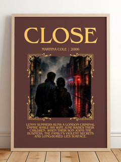 Close Minimalist Book Poster by Martina Cole – framed print leaning on a wooden floor