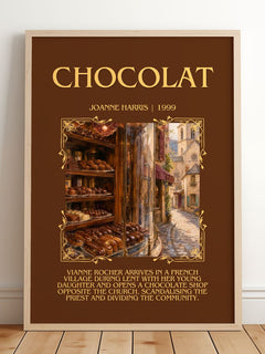 Chocolat Minimalist Book Poster by Joanne Harris – framed print leaning on a wooden floor