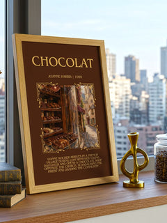 Chocolat Minimalist Book Poster by Joanne Harris – framed print on a city-view windowsill