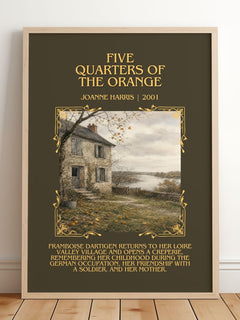 Five quarters of the orange Minimalist Book Poster by Joanne Harris – framed print leaning on a wooden floor