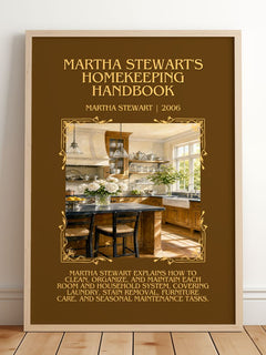 Martha Stewart's Homekeeping Handbook Minimalist Book Poster by Martha Stewart – framed print leaning on a wooden floor