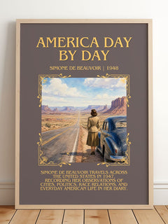 America Day by Day Minimalist Book Poster by Simone de Beauvoir – framed print leaning on a wooden floor