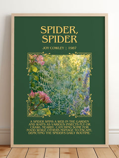 Spider, Spider Minimalist Book Poster by Joy Cowley – framed print leaning on a wooden floor