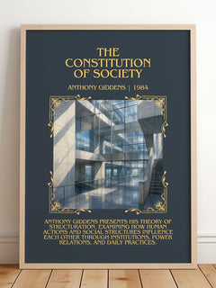The constitution of society Minimalist Book Poster by Anthony Giddens – framed print leaning on a wooden floor