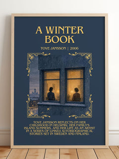 A winter book Minimalist Book Poster by Tove Jansson – framed print leaning on a wooden floor
