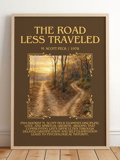 The Road Less Traveled Minimalist Book Poster by M. Scott Peck – framed print leaning on a wooden floor