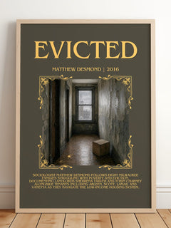 Evicted Minimalist Book Poster by Matthew Desmond – framed print leaning on a wooden floor