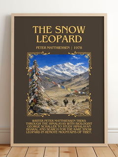The Snow Leopard Minimalist Book Poster by Peter Matthiessen – framed print leaning on a wooden floor