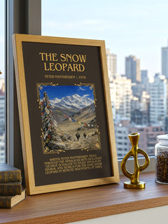 The Snow Leopard Minimalist Book Poster by Peter Matthiessen – framed print on a city-view windowsill
