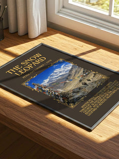 The Snow Leopard Minimalist Book Poster by Peter Matthiessen – print on a sunlit desk