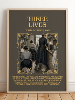 Three Lives Minimalist Book Poster by Gertrude Stein – framed print leaning on a wooden floor