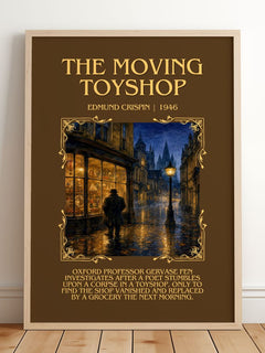 The Moving Toyshop Minimalist Book Poster by Edmund Crispin – framed print leaning on a wooden floor