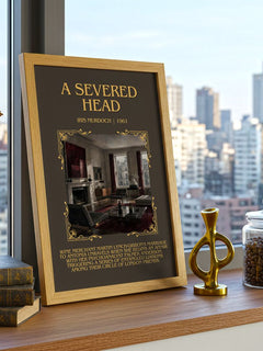 A Severed Head Minimalist Book Poster by Iris Murdoch – framed print on a city-view windowsill