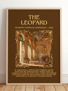 The Leopard Minimalist Book Poster by Giuseppe Tomasi di Lampedusa – framed print leaning on a wooden floor