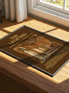 The Leopard Minimalist Book Poster by Giuseppe Tomasi di Lampedusa – print on a sunlit desk