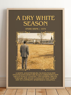 A Dry White Season Minimalist Book Poster by Andre Brink – framed print leaning on a wooden floor
