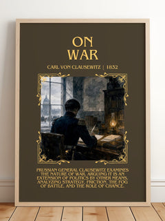 On War Minimalist Book Poster by Carl Von Clausewitz – framed print leaning on a wooden floor