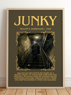 Junky Minimalist Book Poster by William S. Burroughs – framed print leaning on a wooden floor