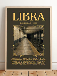 Libra Minimalist Book Poster by Don DeLillo – framed print leaning on a wooden floor