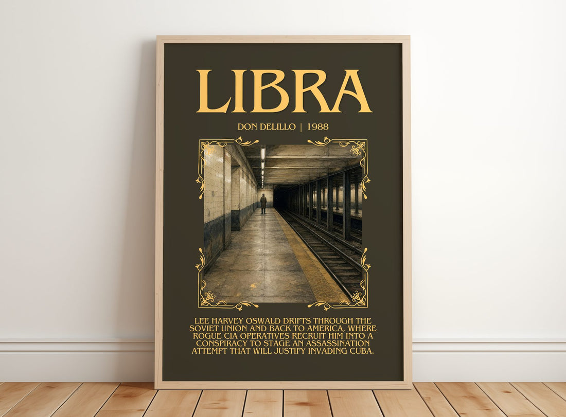 Libra Minimalist Book Poster by Don DeLillo – framed print leaning on a wooden floor