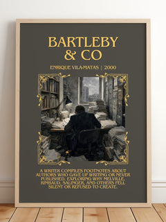Bartleby & Co Minimalist Book Poster by Enrique Vila-Matas – framed print leaning on a wooden floor