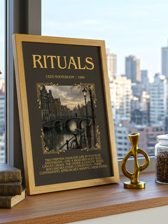 Rituals Minimalist Book Poster by Cees Nooteboom – framed print on a city-view windowsill
