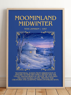 Moominland Midwinter Minimalist Book Poster by Tove Jansson – framed print leaning on a wooden floor
