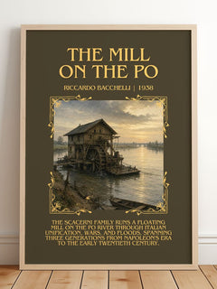 The Mill On The Po Minimalist Book Poster by Riccardo Bacchelli – framed print leaning on a wooden floor