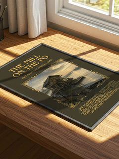 The Mill On The Po Minimalist Book Poster by Riccardo Bacchelli – print on a sunlit desk