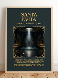 Santa Evita Minimalist Book Poster by Tomás Eloy Martínez – framed print leaning on a wooden floor