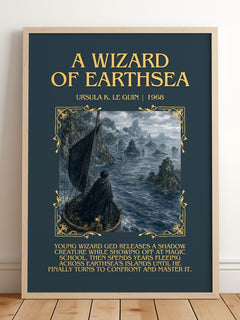 A Wizard Of Earthsea Minimalist Book Poster by Ursula K. Le Guin – framed print leaning on a wooden floor