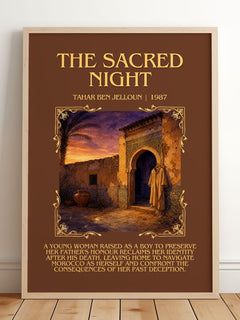 The Sacred Night Minimalist Book Poster by Tahar Ben Jelloun – framed print leaning on a wooden floor