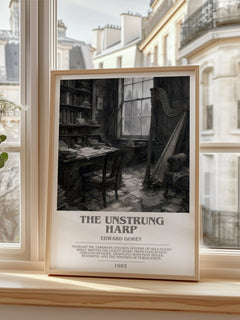 The Unstrung Harp bookish print in frame leaning in hallway – literary fiction wall art