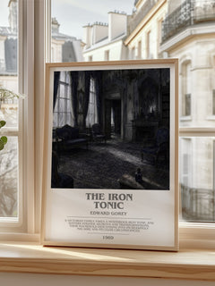 The Iron Tonic bookish print in frame leaning in hallway – childrens wall art