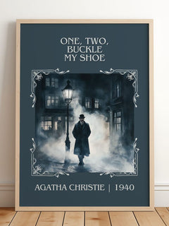 One, Two, Buckle My Shoe Classic Book Art Print by Agatha Christie – framed print leaning on a wooden floor