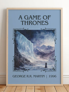 A Game Of Thrones Classic Book Art Print by George R.R. Martin – framed print leaning on a wooden floor