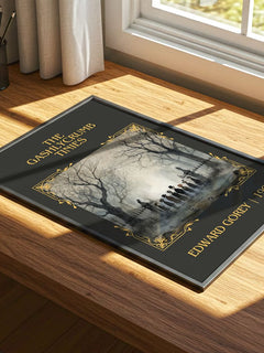 The Gashlycrumb Tinies Classic Book Art Print by Edward Gorey – print on a sunlit desk