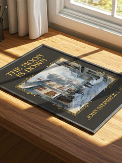 The Moon Is Down Classic Book Art Print by John Steinbeck – print on a sunlit desk