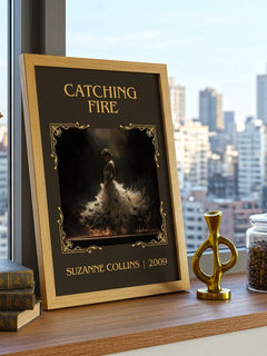 Catching Fire Classic Book Art Print by Suzanne Collins – framed print on a city-view windowsill