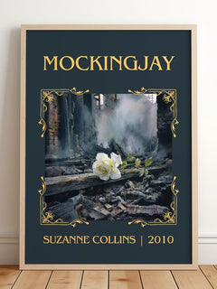 Mockingjay Classic Book Art Print by Suzanne Collins – framed print leaning on a wooden floor