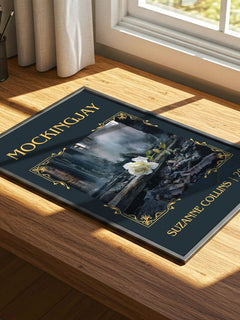 Mockingjay Classic Book Art Print by Suzanne Collins – print on a sunlit desk
