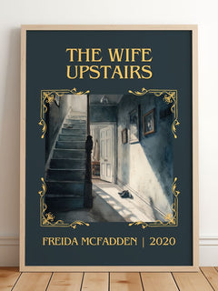 The Wife Upstairs Classic Book Art Print by Freida McFadden – framed print leaning on a wooden floor