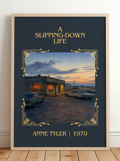A Slipping-Down Life Classic Book Art Print by Anne Tyler – framed print leaning on a wooden floor