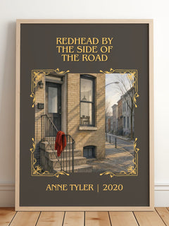 Redhead By The Side Of The Road Classic Book Art Print by Anne Tyler – framed print leaning on a wooden floor